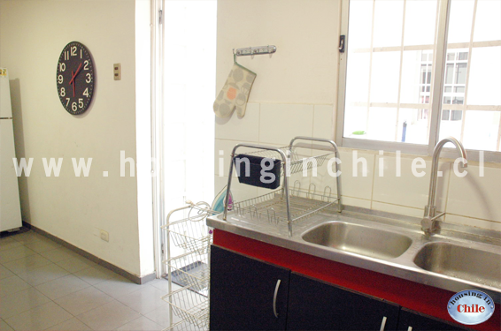 RE-RY: Kitchen and access to the interior patio with laundry area